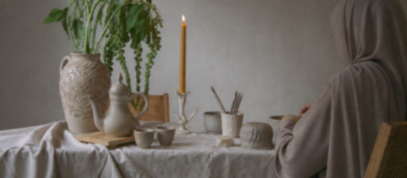 Handmade ceramics on a linen-covered table at ROA Art studio in Ras Al Khaimah