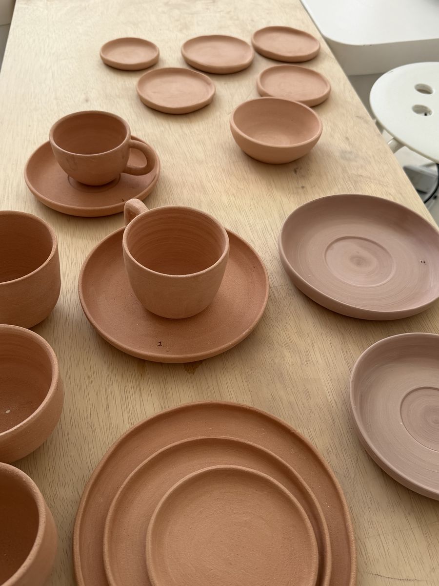 Terracotta cups and saucers from a ROA Art bespoke café order