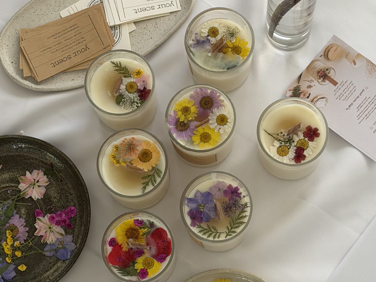 Pressed-flower soy candles made in the ROA Art boutique candle workshop